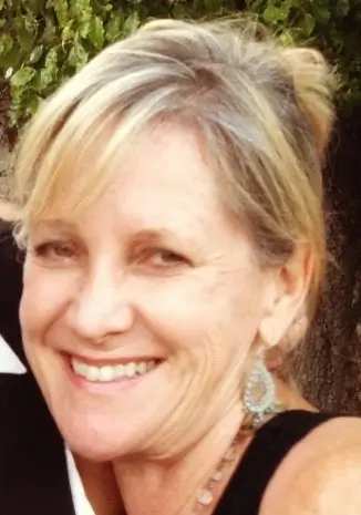 Kate Chipman, a smiling wedding officiant.